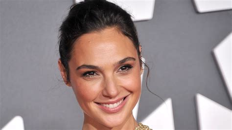 Gal Gadot soaks up the sun donning high